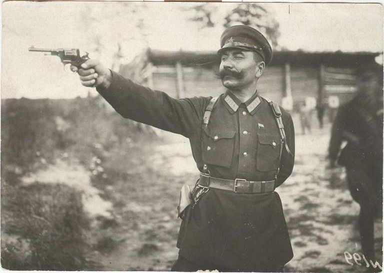 Семен Буденный стреляет из револьвера. 1920 год Семен Буденный стреляет из револьвера. 1920 год