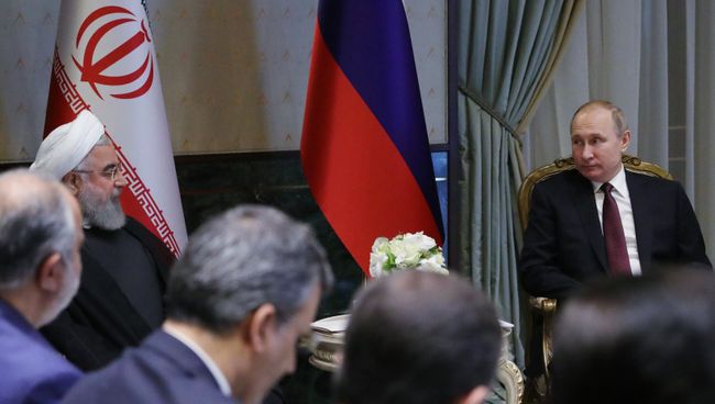 Президент РФ Владимир Путин и президент Исламской Республики Иран Хасан Рухани во время встречи в Анкаре. 4 апреля 2018 Президент РФ Владимир Путин и президент Исламской Республики Иран Хасан Рухани во время встречи в Анкаре. 4 апреля 2018