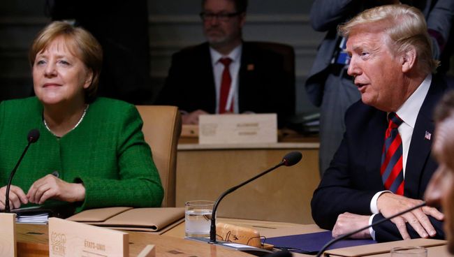 Ангела Меркель и Дональд Трамп на саммите G7 в Квебеке. Июнь 2018 Ангела Меркель и Дональд Трамп на саммите G7 в Квебеке. Июнь 2018
