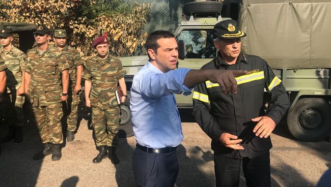 Премьер-министр Греции Алексис Ципрас во время посещении деревни Мати Премьер-министр Греции Алексис Ципрас во время посещении деревни Мати