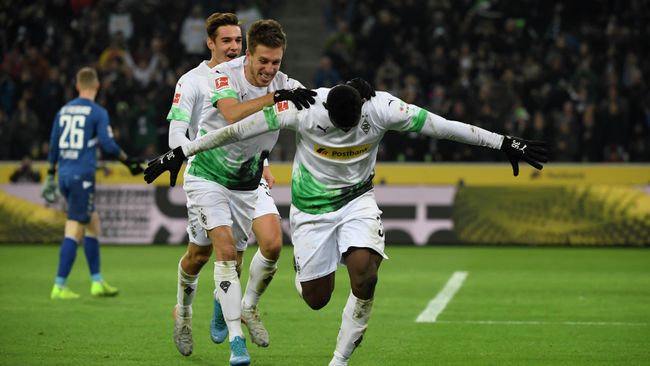 Moenchengladbach's Swiss forward Breel Embolo (R) celebrates with German forward Patrick Herrmann after scoring a goal during the German first division Bundesliga football match Borussia Moenchengladbach vs SC Freiburg in Moenchengladbach, western Germany on December 1, 2019. - Moenchengladbach's Swiss forward Breel Embolo (R) celebrates with German forward Patrick Herrmann after scoring a goal during the German first division Bundesliga football match Borussia Moenchengladbach vs SC Freiburg in Moenchengladbach, western Germany on December 1, 2019. (Photo by INA FASSBENDER / AFP) Moenchengladbach's Swiss forward Breel Embolo (R) celebrates with German forward Patrick Herrmann after scoring a goal during the German first division Bundesliga football match Borussia Moenchengladbach vs SC Freiburg in Moenchengladbach, western Germany on December 1, 2019. - Moenchengladbach's Swiss forward Breel Embolo (R) celebrates with German forward Patrick Herrmann after scoring a goal during the German first division Bundesliga football match Borussia Moenchengladbach vs SC Freiburg in Moenchengladbach, western Germany on December 1, 2019. (Photo by INA FASSBENDER / AFP)