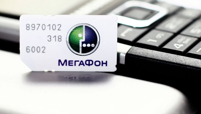 Сим-карта с логотипом оператора сотовой связи Мегафон. Архив Сим-карта с логотипом оператора сотовой связи Мегафон. Архив