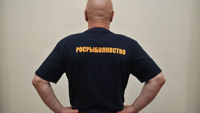 Форменная одежда для должных лиц Федерального агентства по рыболовству. Архивное фото Форменная одежда для должных лиц Федерального агентства по рыболовству. Архивное фото