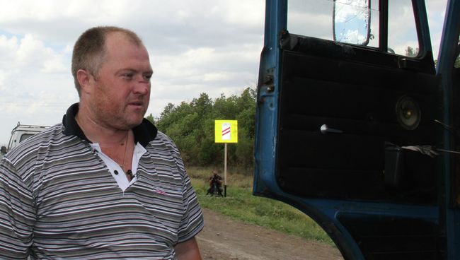Пострадавший от взрывов водитель Евгений Харченко