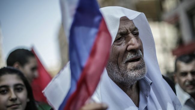 Участники митинга в поддержку президента Сирии Башара Асада и президента России Владимира Путин в Латакии. Архивное фото Участники митинга в поддержку президента Сирии Башара Асада и президента России Владимира Путин в Латакии. Архивное фото