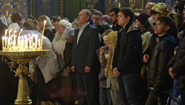 В.Путин посетил Рождественское богослужение. Фото с места события