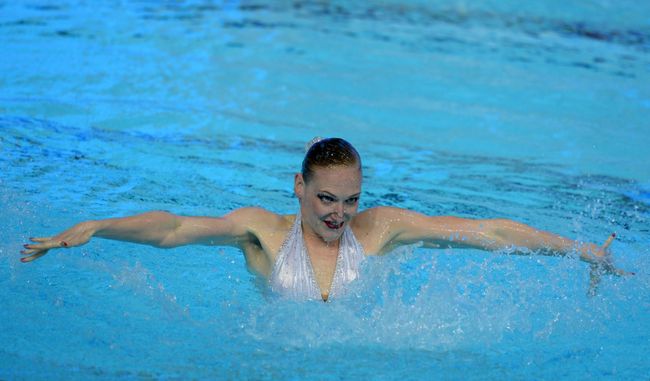 Светлана Ромашина (Россия) выступает в произвольной программе финальных соревнований по синхронному плаванию Светлана Ромашина (Россия) выступает в произвольной программе финальных соревнований по синхронному плаванию
